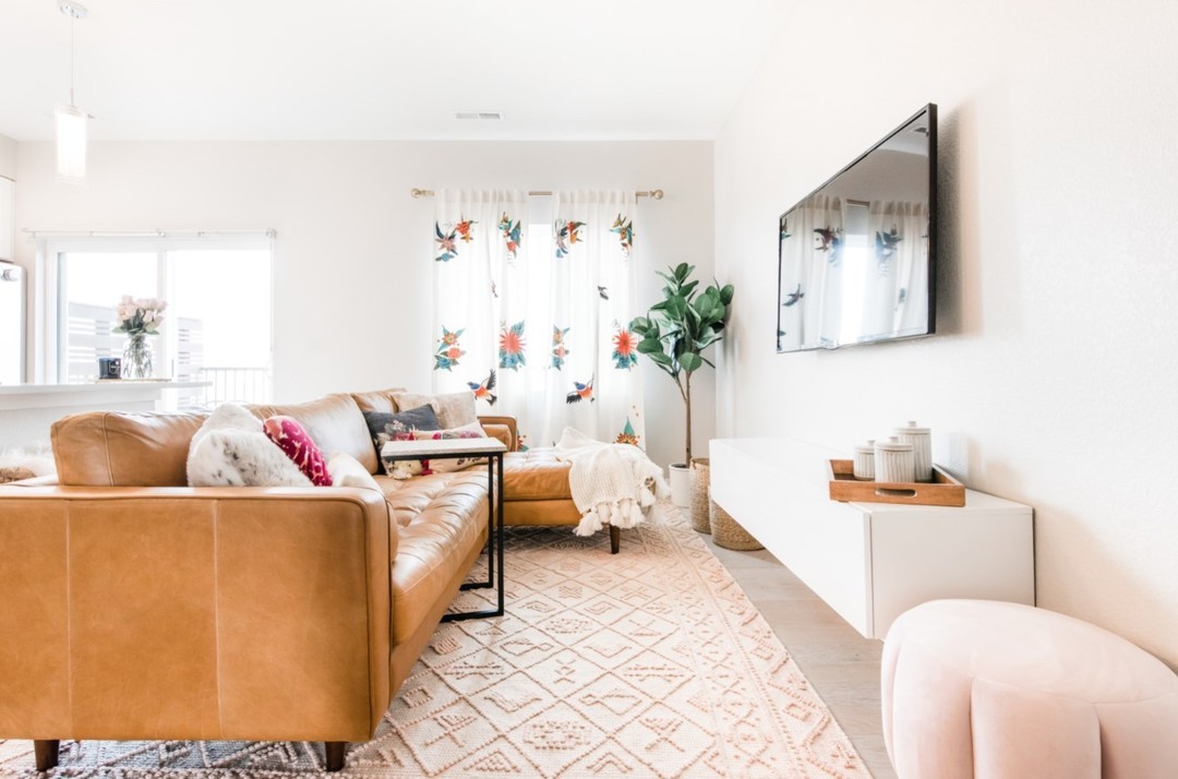 Article Sven sectional with chaise arranged in a small apartment living room.